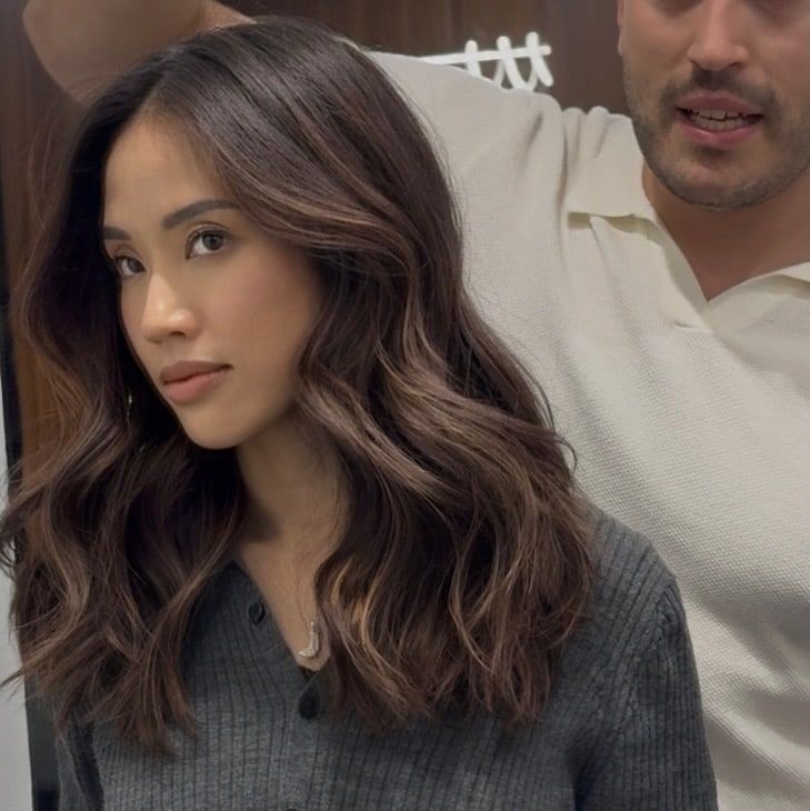 Dark brunette waves with caramel tones through the lengths